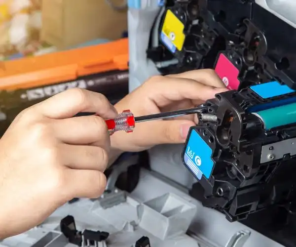 Technician providing Zebra barcode printer repair service in UAE