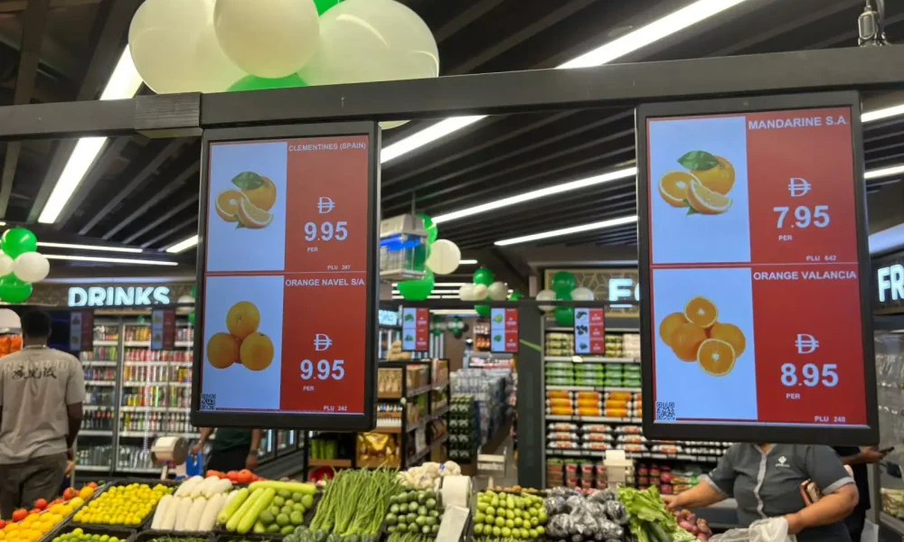 Produce aisle at New W Mart using ZKONG digital shelf displays for dynamic pricing